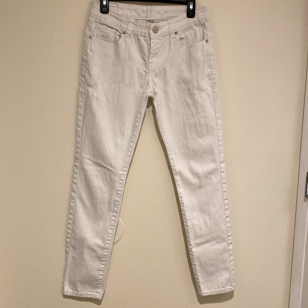 NV brand jeans. White slim fit below the waist. Worn look.